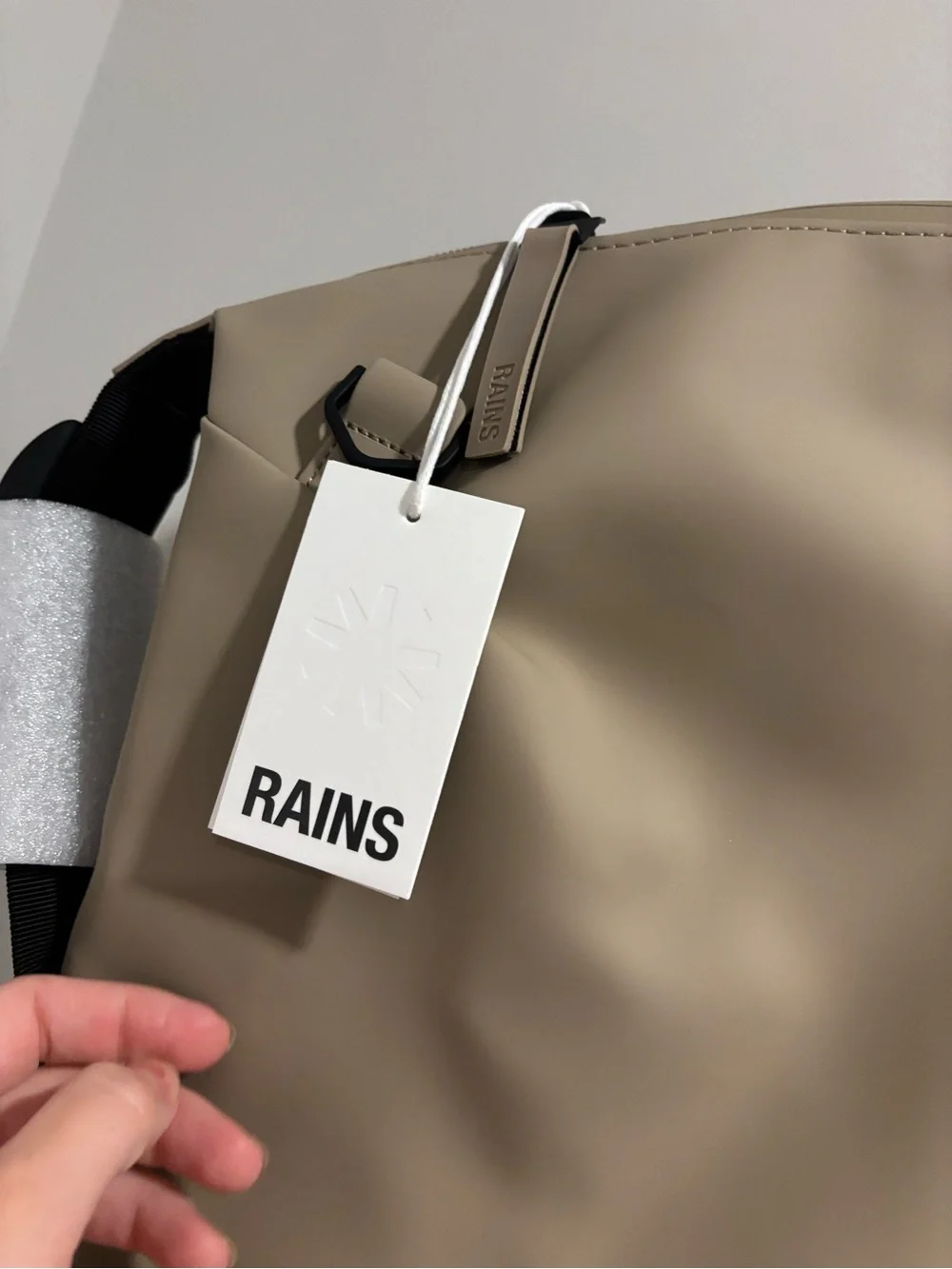 Rains Hilo Duffel Bag in Taupe with Black Straps
